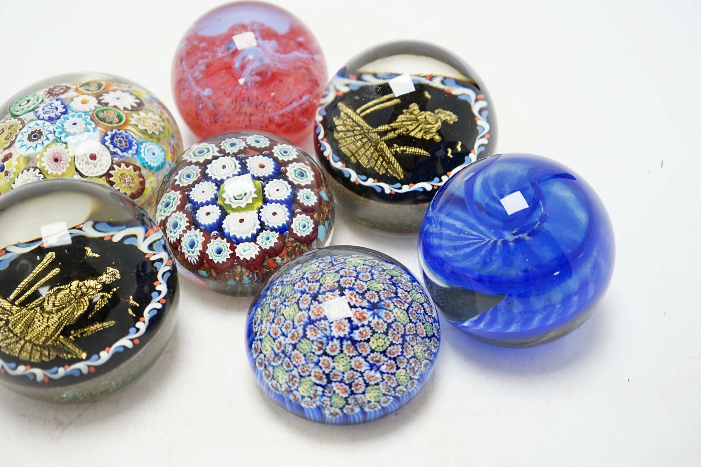 A group of eight various glass paperweights including millefiori, tallest 8cm. Condition - varies, poor to fair